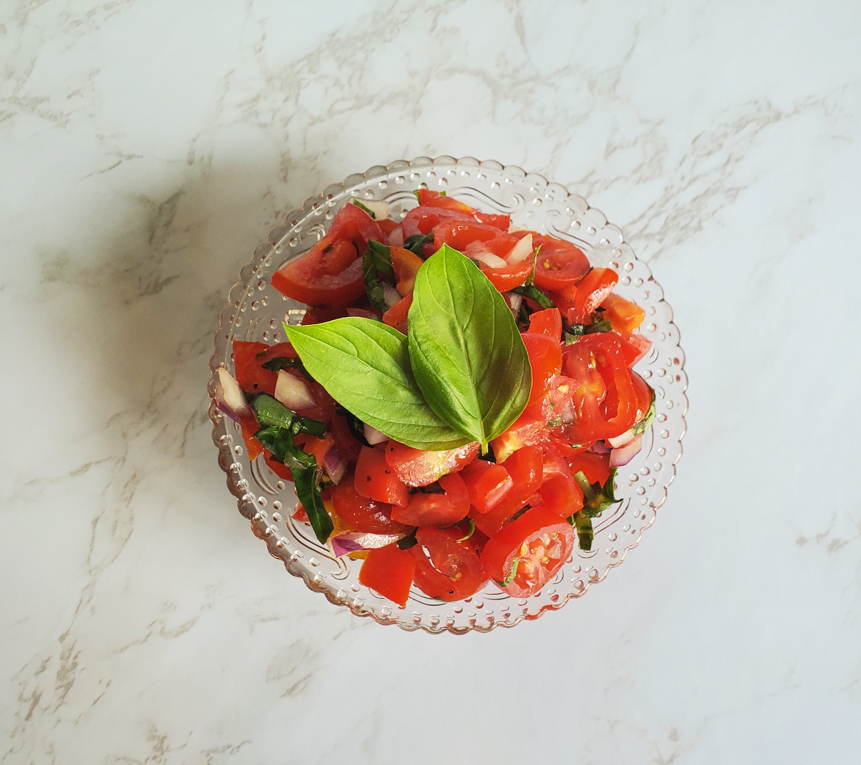 Tomato Bruschetta in a glass antique dish.