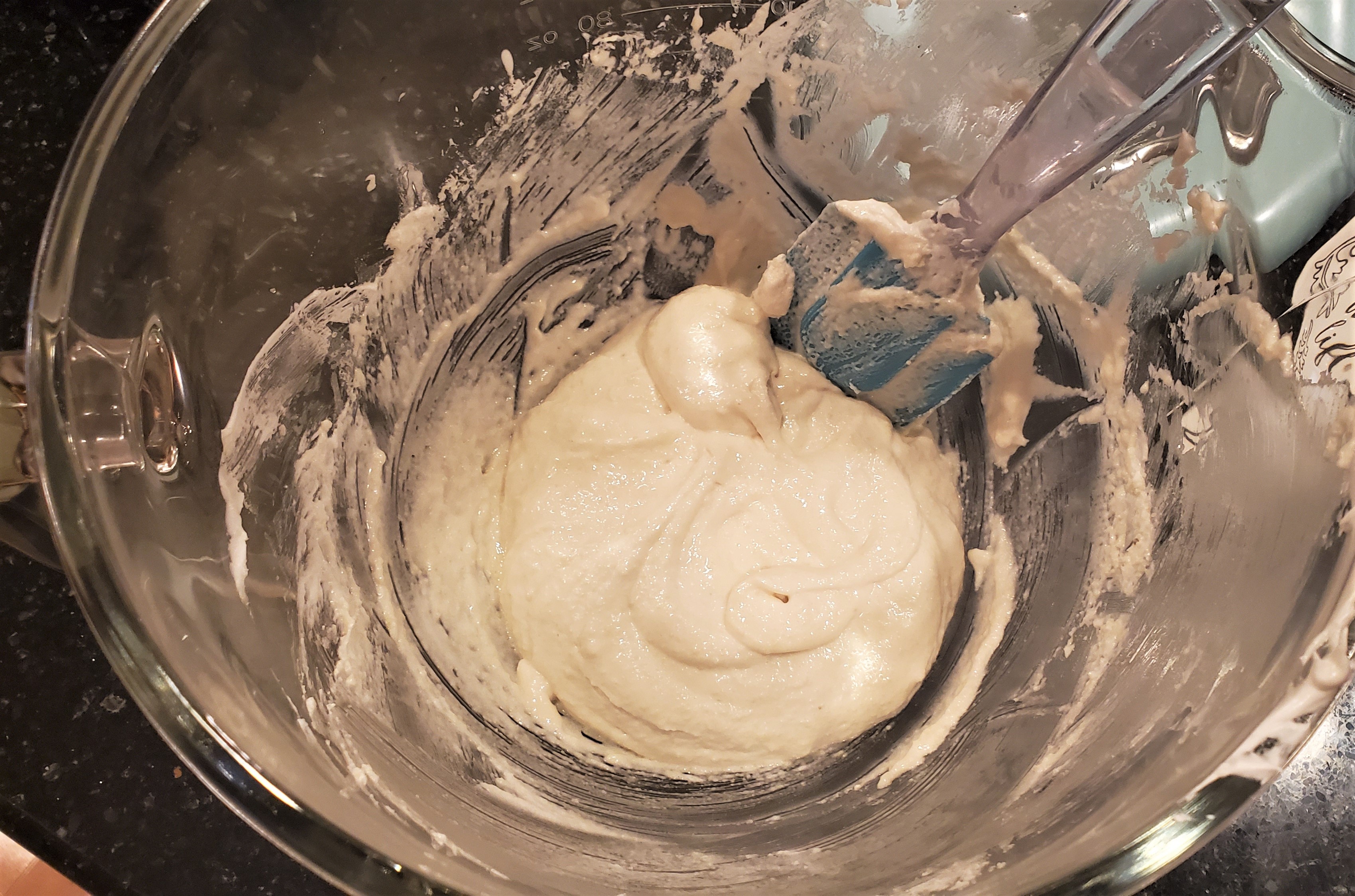 The inside of a bowl that shows the ideal consistency for your macaron batter. Sift, yet runny.